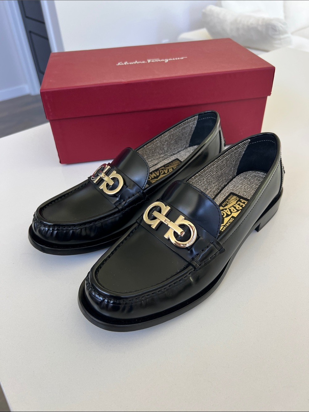 Salvatore Ferragamo ofelia black leather with gold tone gancini hardware loafers